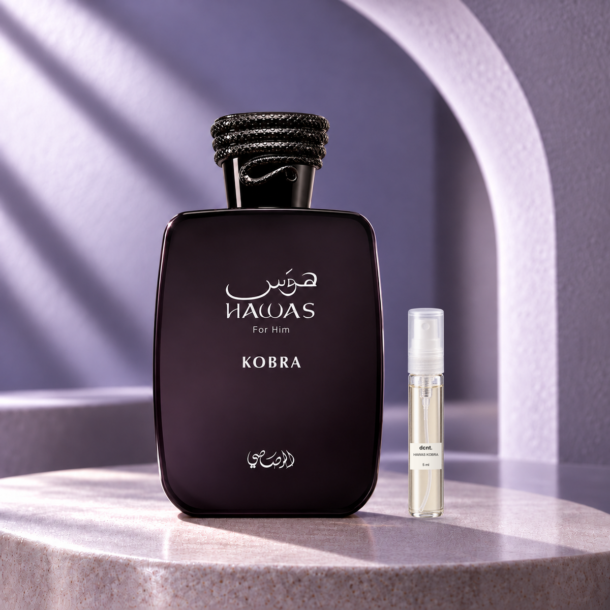 Hawas Kobra original perfume bottle beside a filled 5 ml dcnt.ph glass decant